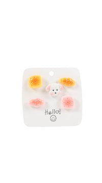 Pastel pastry and dog pin set on clear backing card with six pins