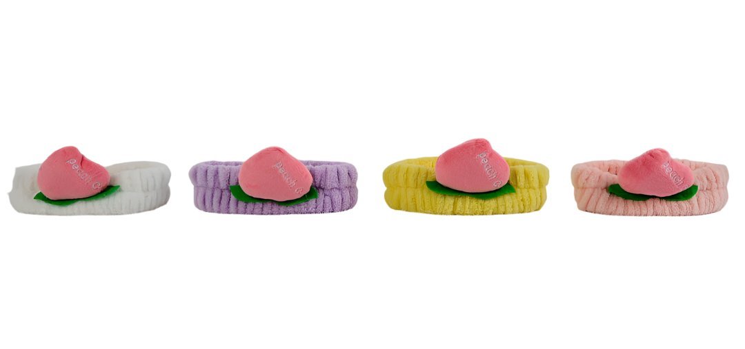 Set of fuzzy peach-themed headbands in mixed colors with pink peach slice details