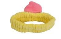 Fuzzy peach-themed headband with yellow band and pink peach slice