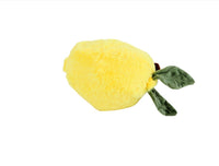 Plush lemon toy with fuzzy yellow body and green leaf detail on one side