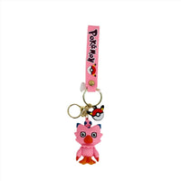 PVC keychain with a pink character figure and metal key ring on a pink strap