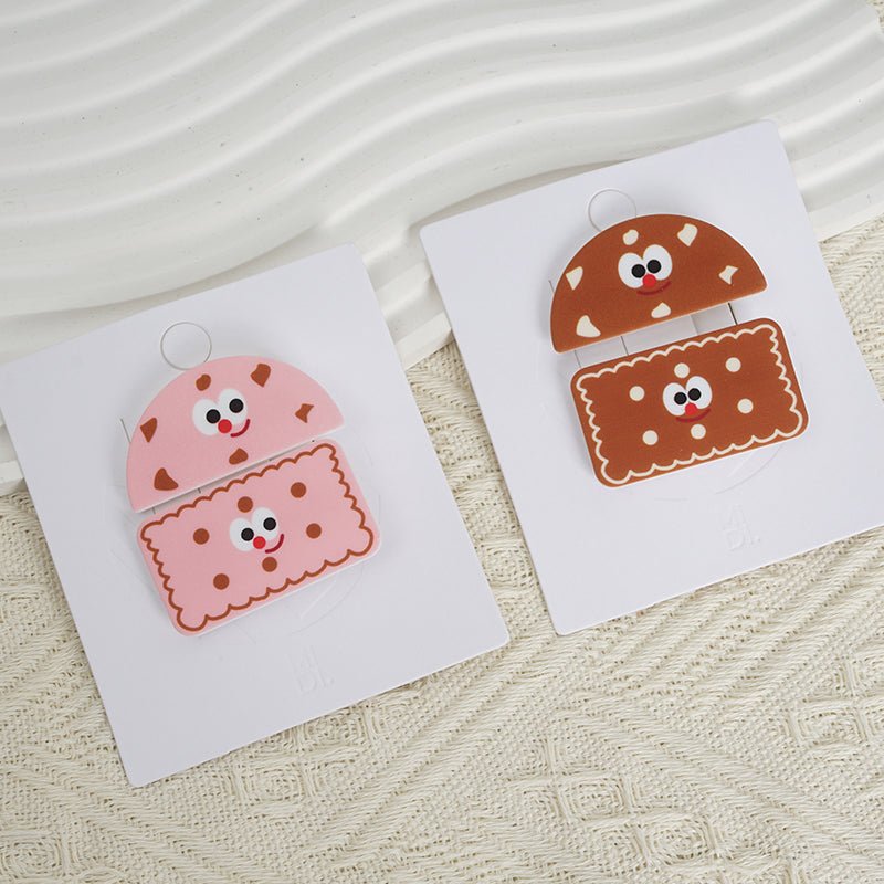 Cookie-themed pencil case on cards, featuring pink and brown smiling cookie face designs.