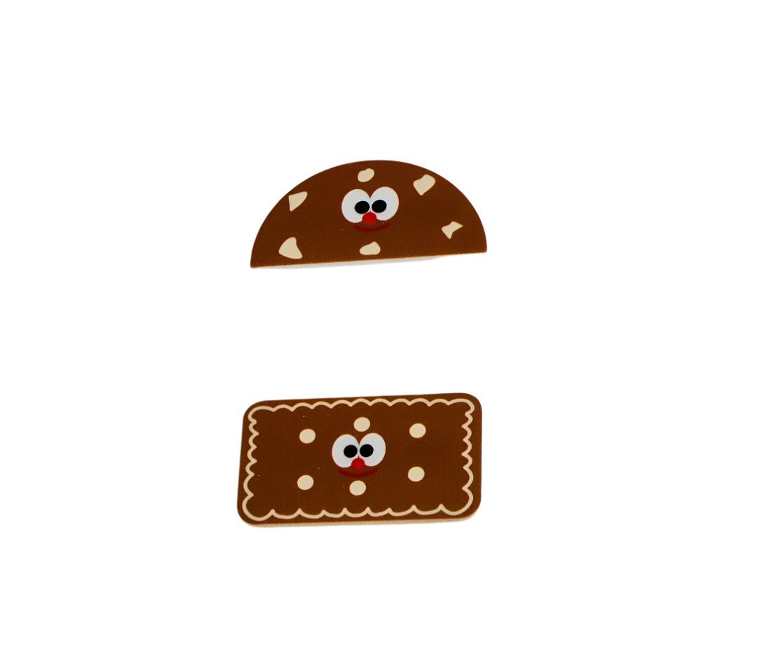 Brown cookie-themed pencil case with smiling cookie face and scalloped cookie panel.