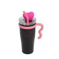 Insulated tumbler with pink side handle and clear lid, pink heart topper and straw.