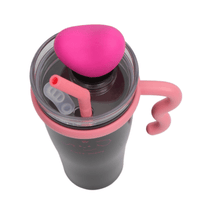 Insulated tumbler top view: clear lid, pink heart topper, pink straw and tab handle.