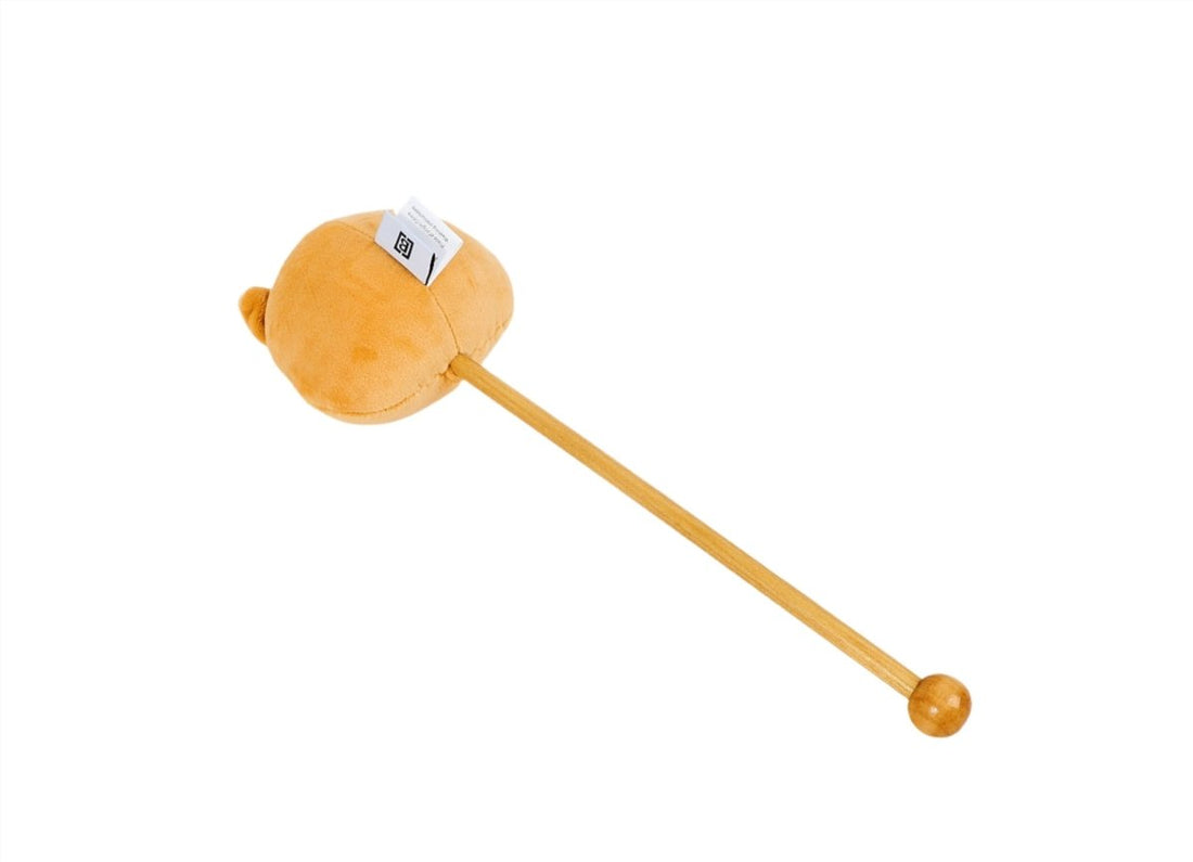 Plush puppy toy stick with orange head, long wooden stick, and ball end