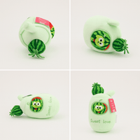 Light green watermelon plush toy with cartoon face patch and green striped stem