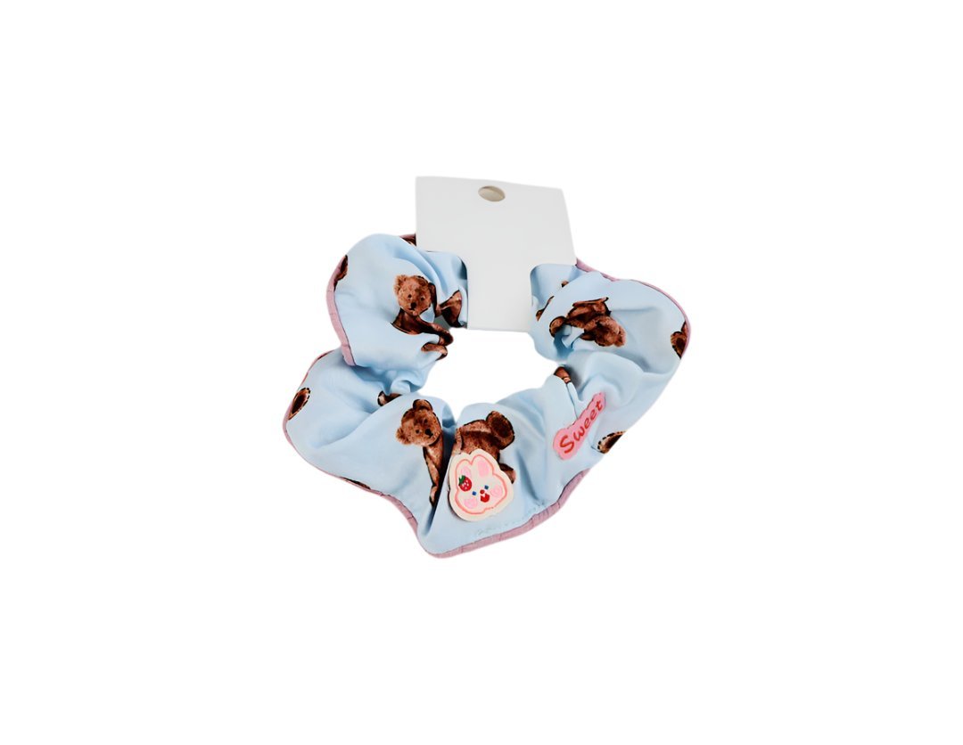 Hair scrunchie in light blue fabric with bear print, soft gathered loop