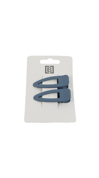 Two dark blue claw hair clips on card backing, each with curved teeth