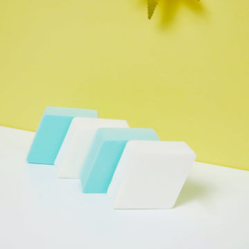 Diamond makeup sponge set with white and light blue sponges, angled stack