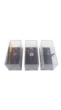 Three die-cast motorcycle models in display boxes, front angle views