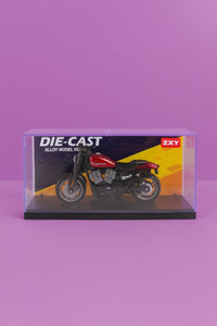Die-cast motorcycle model in clear display box, black and yellow, side view