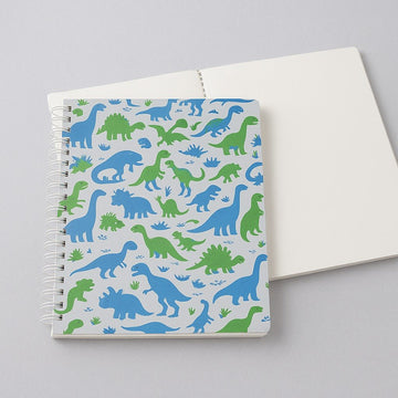 Spiral dinosaur notebook with blue and green dinosaur pattern on the open cover