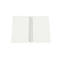 A6 spiral notebook open inside, blank ruled pages with coil spiral at center