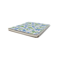 Dinosaur notebook with blue and green dinosaur pattern cover, side view