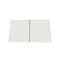 Dinosaur notebook with blank pages and visible stitched spine