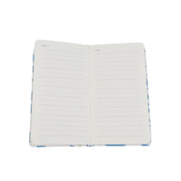 A6 hardcover notebook open with lined pages and date fields