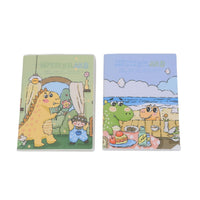 A5 dinosaur notebook pair: green and blue frosted plastic covers with cartoon scenes.