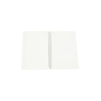 Spiral notebook open to blank ruled pages, visible central spiral binding