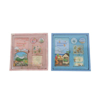 Kids dinosaur notebook set gift boxes, one pink and one blue, with stationery inside