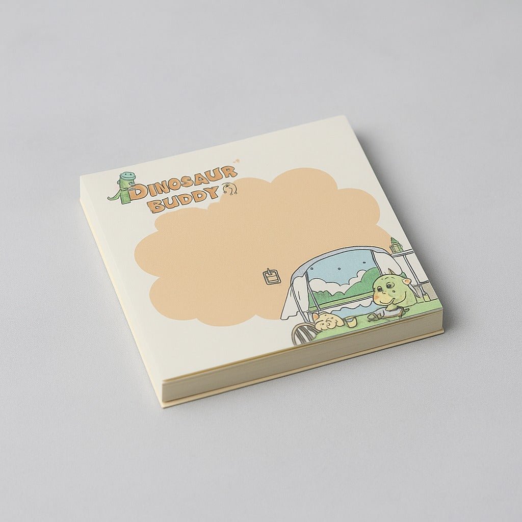 Square memo pad with 'Dinosaur Buddy' cover and dino in blue vehicle scene