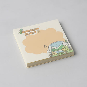 Square memo pad with 'Dinosaur Buddy' cover and dino in blue vehicle scene