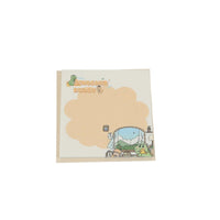 Square memo pad with 'Dinosaur Buddy' cover and dino in blue vehicle scene