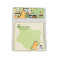 Square memo pad in clear package, 'Dinosaur Buddy' cover with green T-rex and kid dino