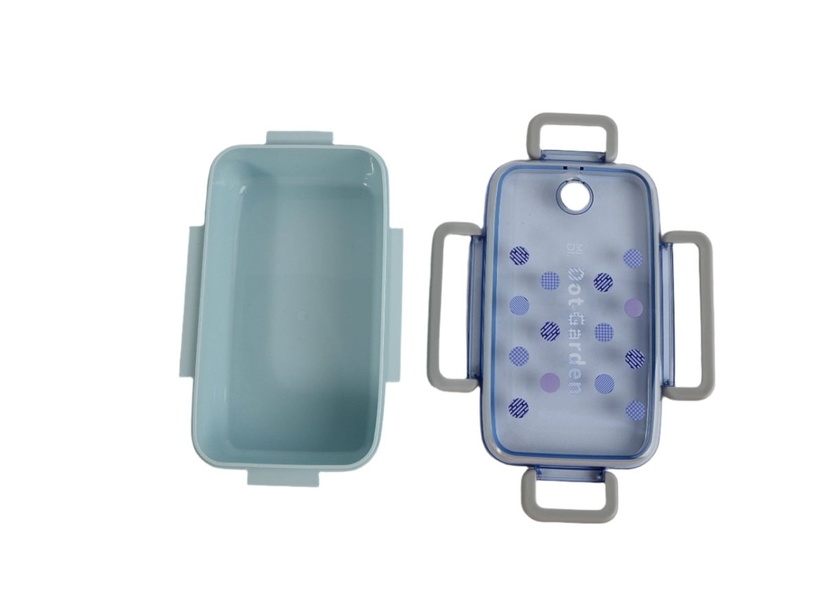 Light blue lunch box with hinged lid and blue dotted front, open view