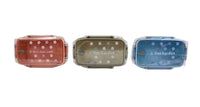 Three DotGarden lunch boxes in rust, olive, and blue with dot patterns