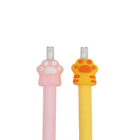 Close-up of pink and yellow paw print gel pen tops with paw-shaped caps
