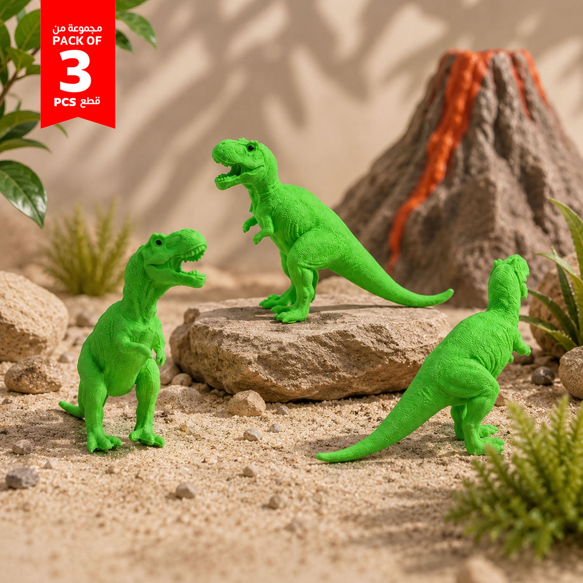 Set of three green T-rex dinosaur toy figures on rocks