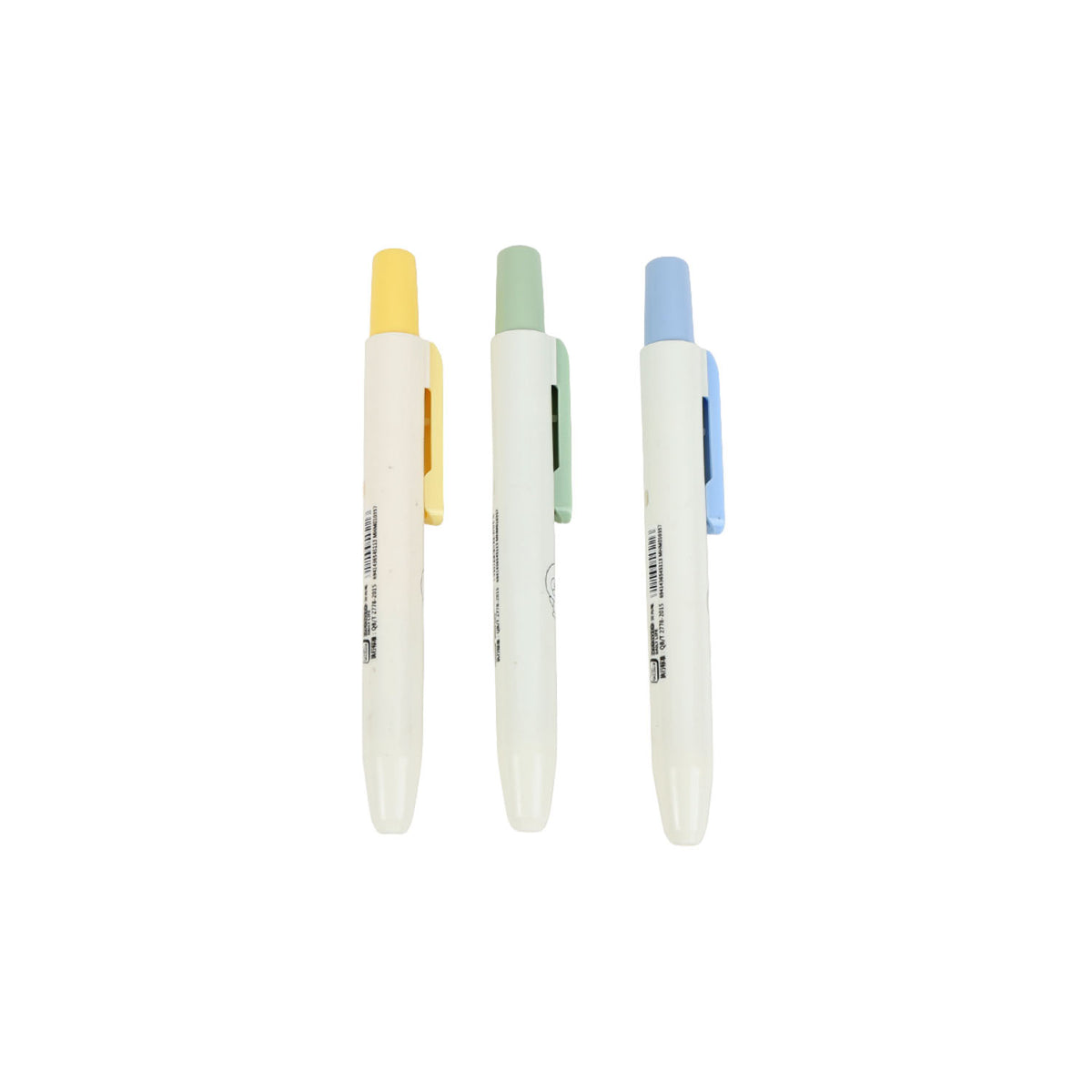 Set of pastel highlighter pens with yellow, green, and blue tips on white barrels