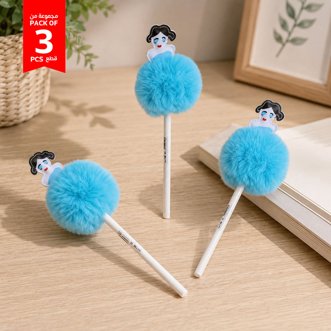Set of 3 blue fluffy ball pens on tabletop with decorative girl charms