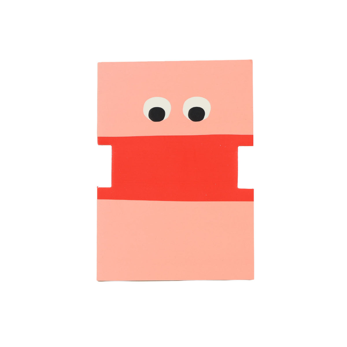 Cartoon face notebook with pink top, red middle and bottom, big googly eyes
