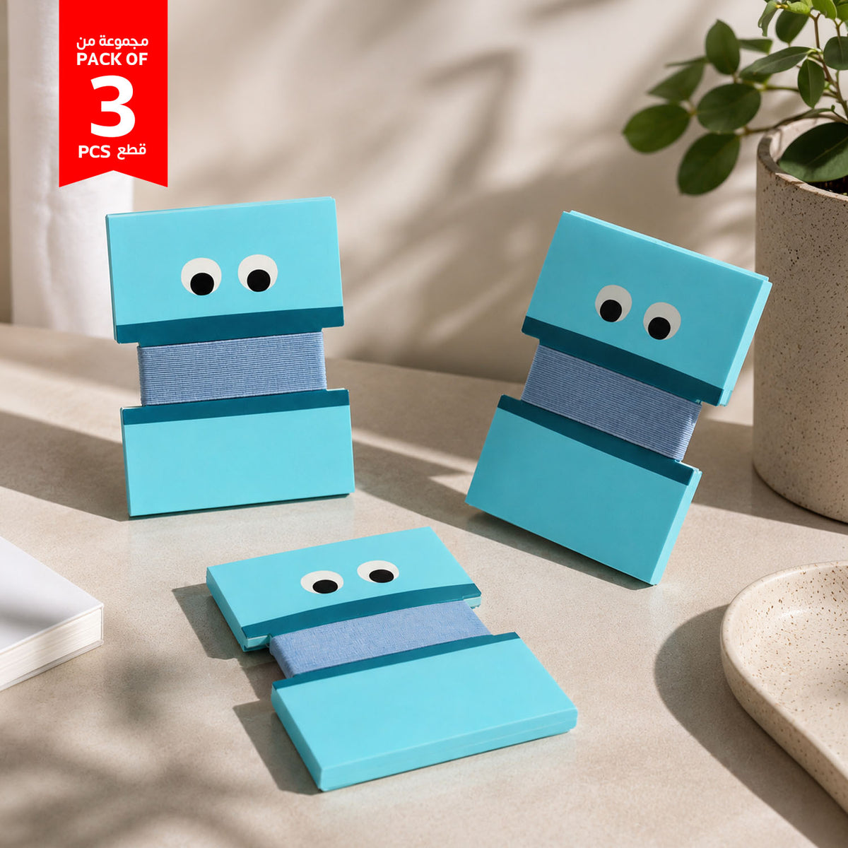 Pack of 3 blue cartoon cable organizers, stacked with big eye faces and fabric strap