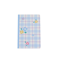Light blue plaid notebook cover with colorful flower decals
