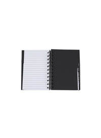 Black spiral notebook open showing lined pages and black back cover