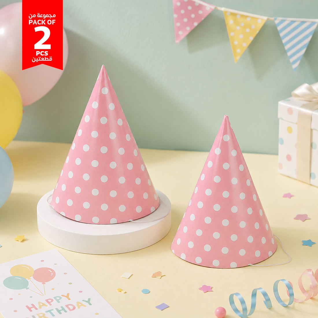 Pink polka dot party hats (2-pack): two cone hats with elastic chin strings