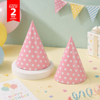 Pink polka dot party hats (2-pack): two cone hats with elastic chin strings