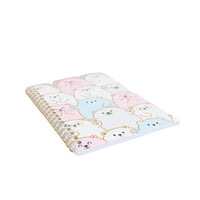 Spiral notebook with pastel bear illustration cover and gold coil binding