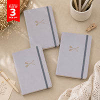Set of 3 grey A5 hardback notebooks with gold geometric emblem on covers
