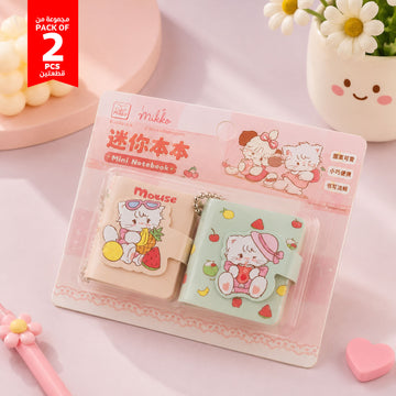 Pack of 2 mini cartoon notebooks with keychain charms, pink blister packaging