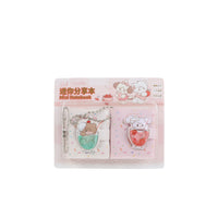 Pink mini notebook set with keychain charms, cute bear and strawberry-themed covers