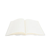 Open B5 notebook with cream binding and lined pages