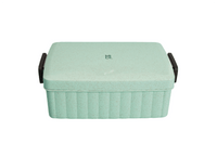 Eco-friendly lunchbox in mint with ridged sides and black handle tabs
