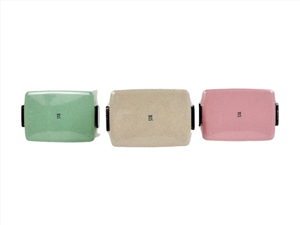 Eco-friendly lunchboxes set in mint, beige, and pink with black handle tabs