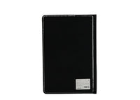Black notebook cover with stitched border and barcode label