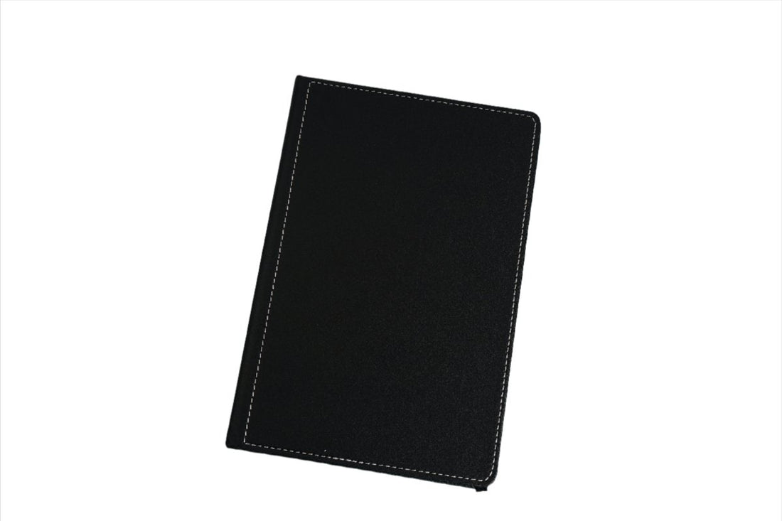 Black durable notebook with stitched cover, front view