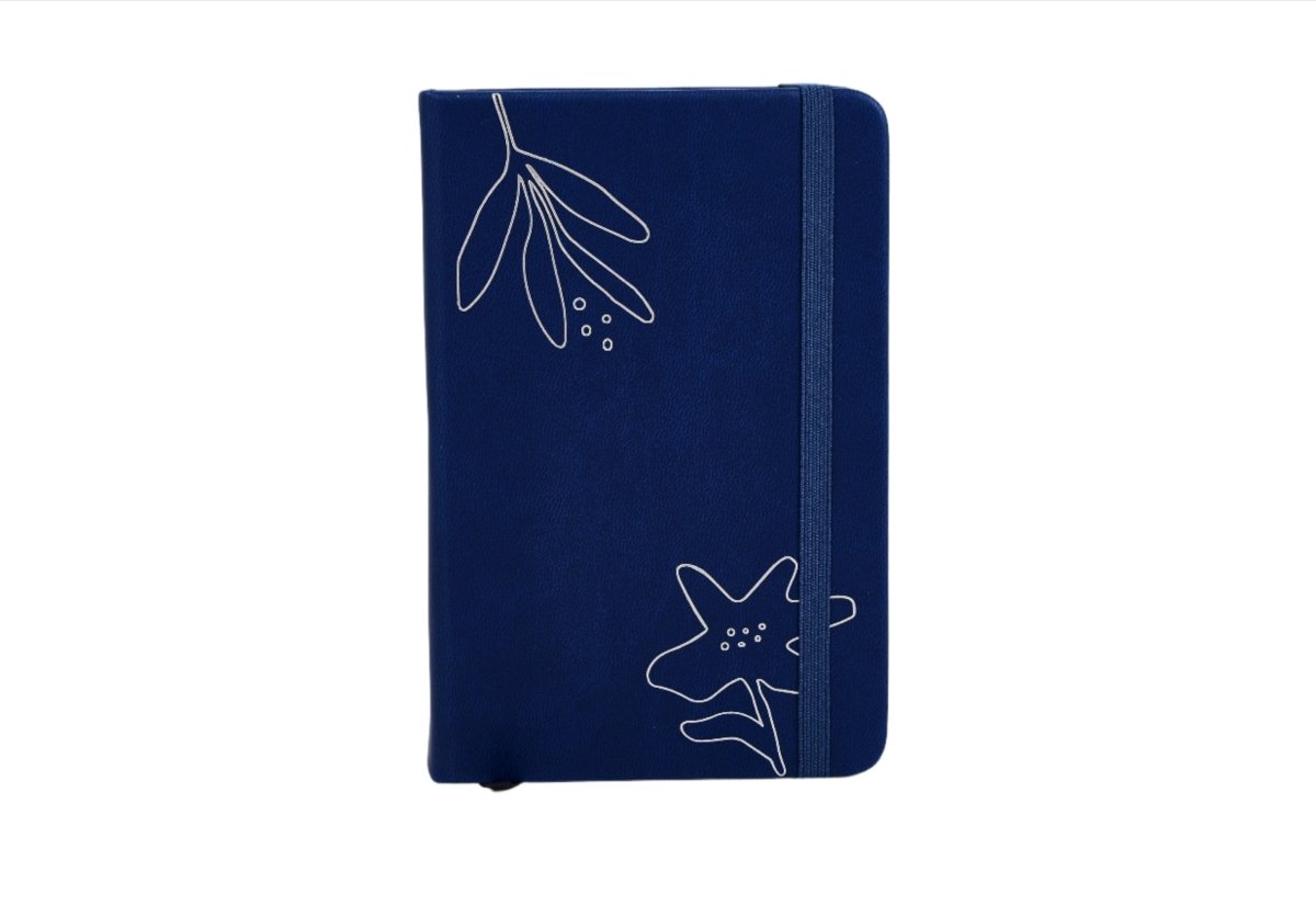 Navy botanical notebook with blue fabric cover, line drawings, and fabric spine